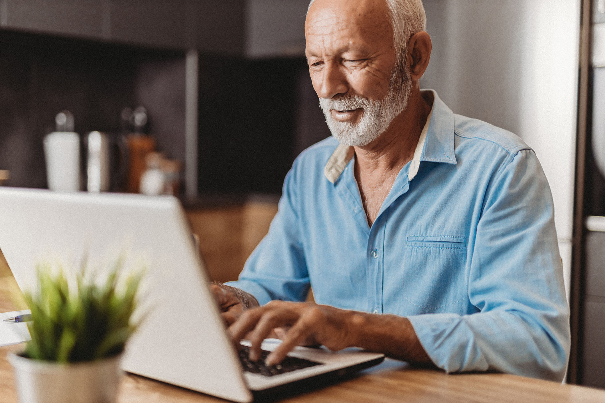 Man typing on laptop