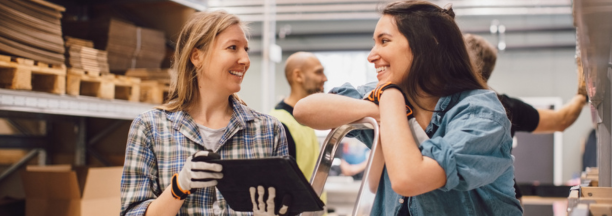 Two employees discuss benefits