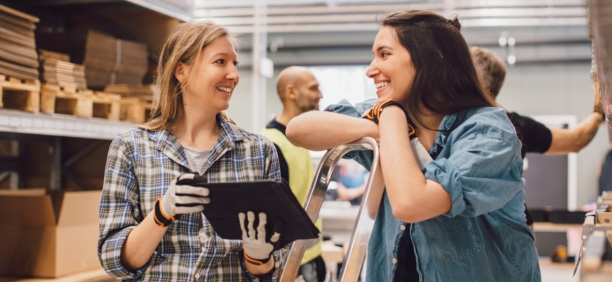 Two employees discuss benefits