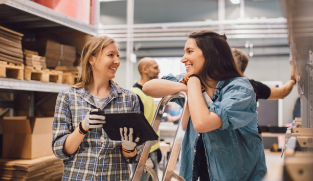 Two employees discuss benefits